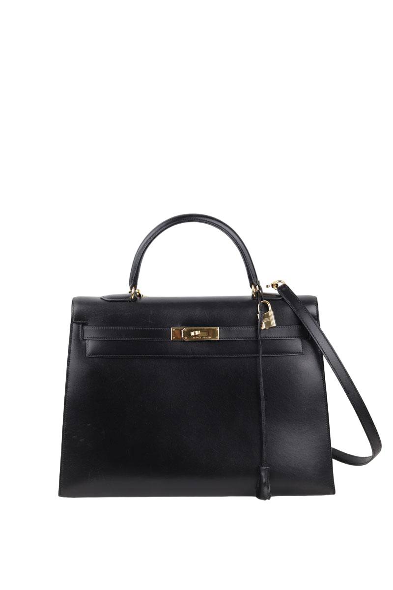 Sac à main Kelly 35, Année 1996 OOZ, en cuir box, avec sa bandoulière et  son cadenas, dans sa Très légères griffures au niveau du 