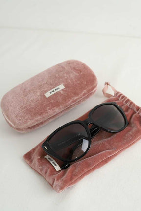 Lunettes de soleil Miu Miu  Noir