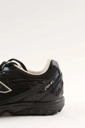 Baskets New Balance 204L Noir en Cuir