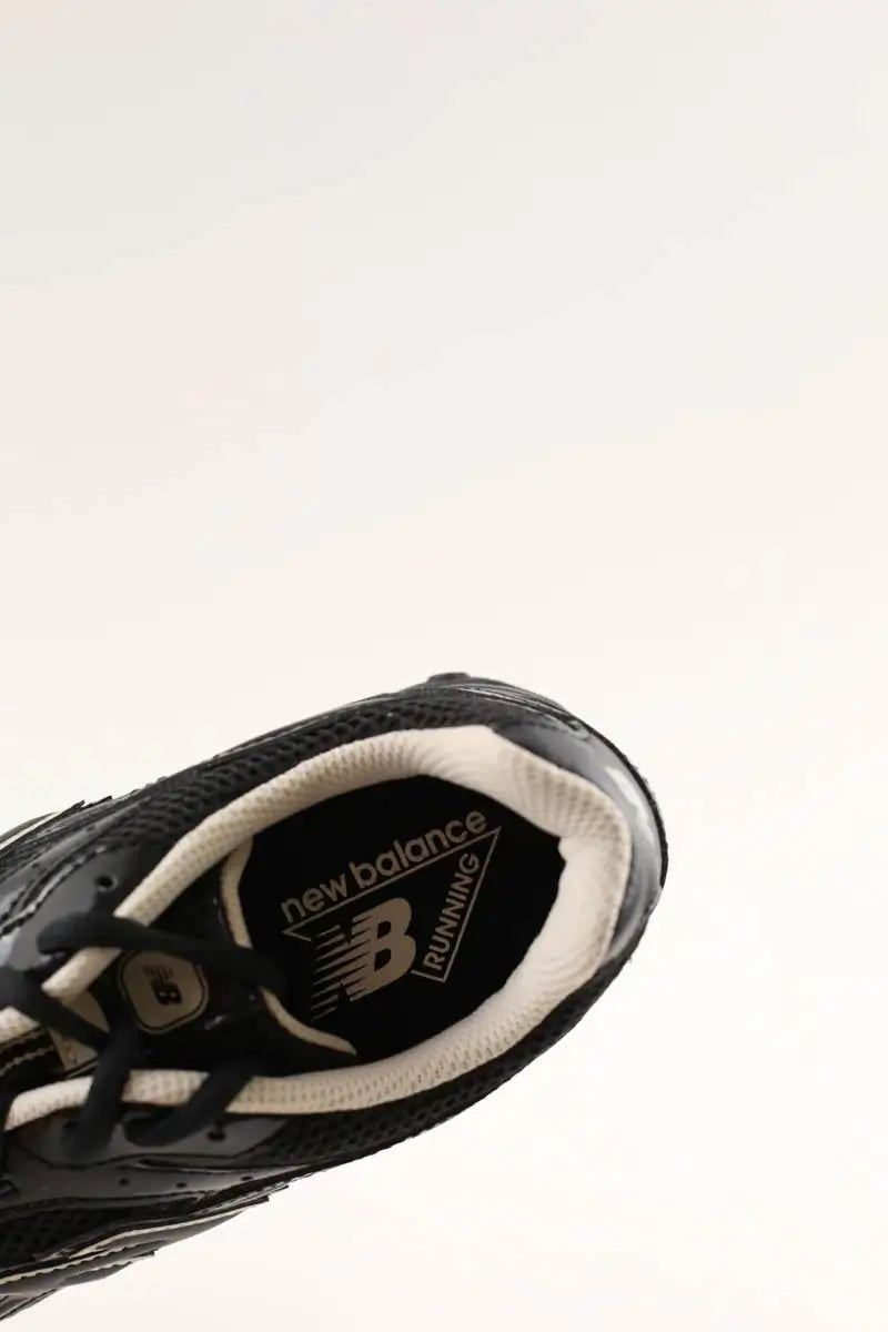 Baskets New Balance 204L Noir en Cuir