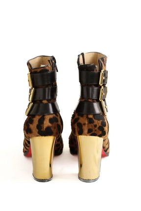 Boots à boucles Christian Louboutin Marron en Cuir