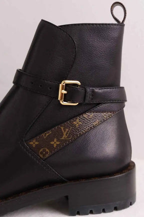 Boots à boucles Louis Vuitton Discovery Flat Noir en Cuir