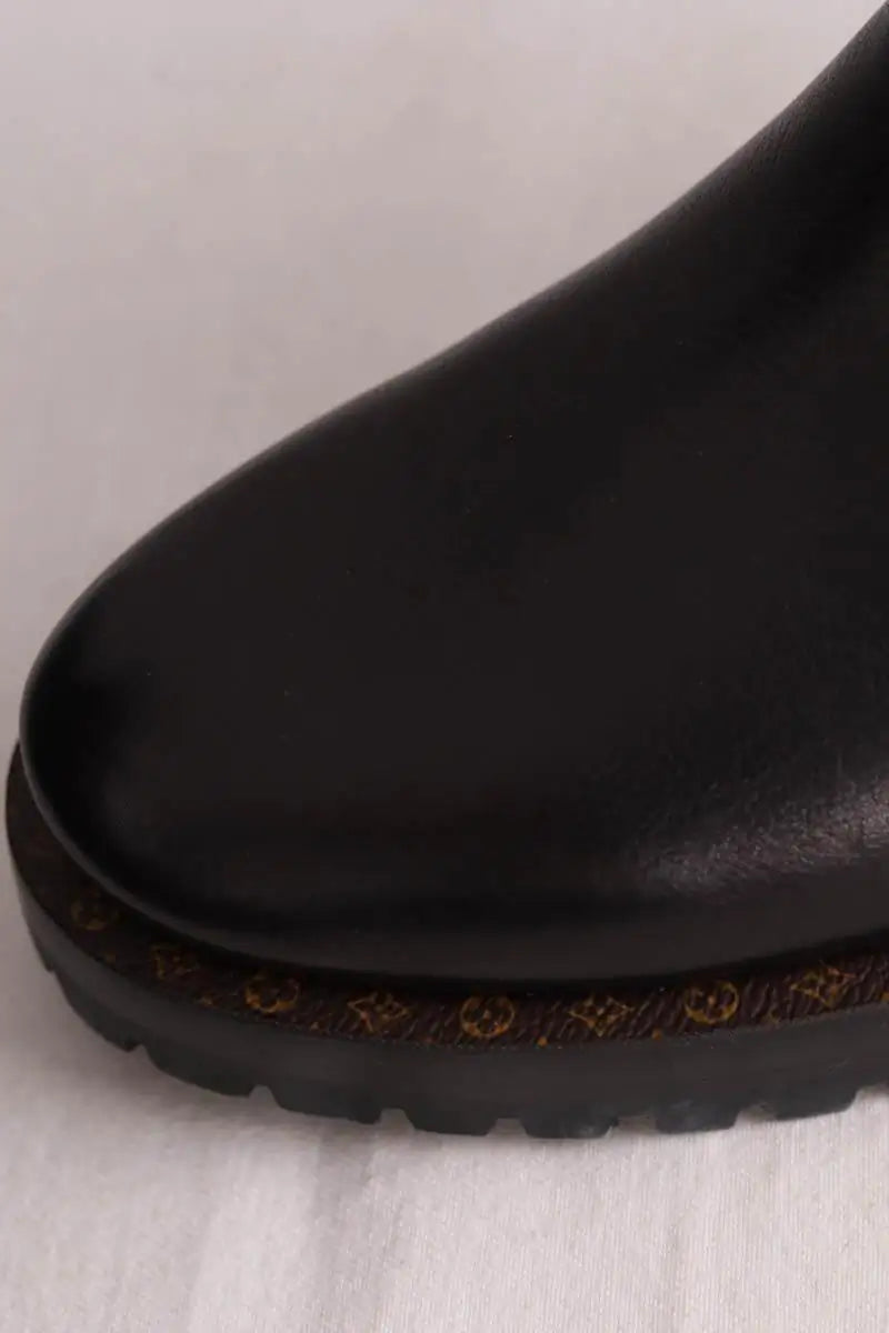 Boots à boucles Louis Vuitton Discovery Flat Noir en Cuir