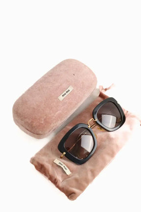 Lunettes de soleil Miu Miu Noir en Plastique