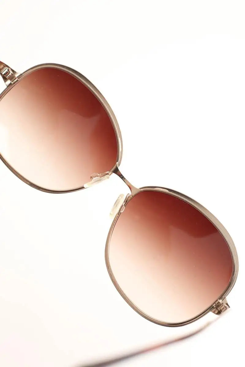 Lunettes de soleil Oliver Peoples Marron en Métal
