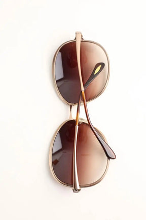 Lunettes de soleil Oliver Peoples Marron en Métal