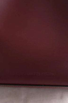 Sac à bandoulière Kitesy Martin Studio Le Sac seau Bordeaux en Cuir